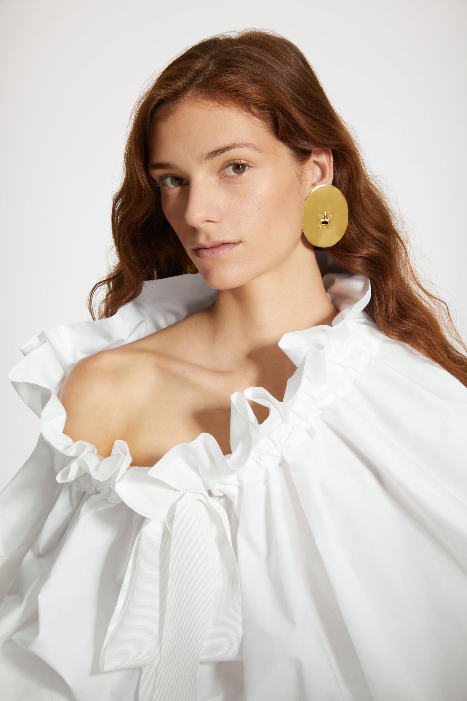 Patou  Large face brass clip-on earrings